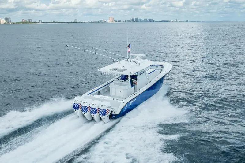 Slide: The Image of 2023 Yellowfin 39 Offshore boat cruising on open water, showcasing powerful engines. - 32