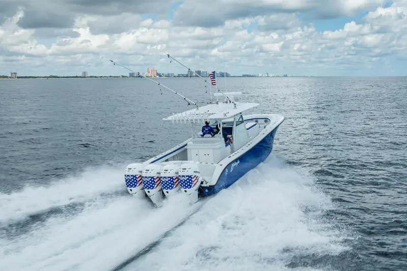 Slide: The Image of 2023 Yellowfin 39 Offshore boat cruising on open water under cloudy skies. - 33