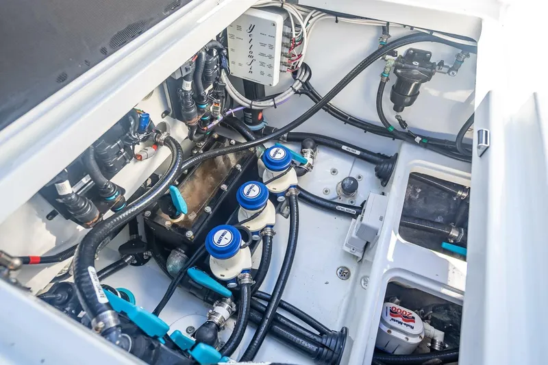 Slide: The Image of 2023 Yellowfin 39 Offshore boat engine compartment with wiring and components. - 37