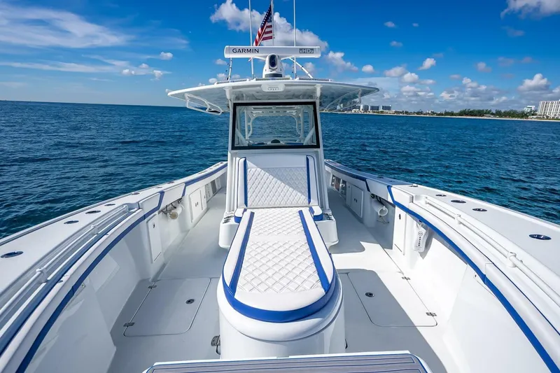 Slide: The Image of 2023 Yellowfin 39 Offshore boat on open water, featuring sleek design and spacious deck. - 43