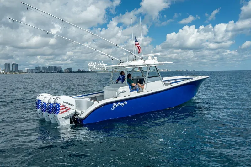 Slide: The Image of 2023 Yellowfin 39 Offshore boat on open water, featuring multiple outboard engines. - 5