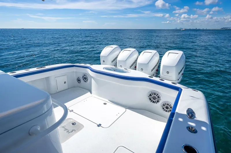 Slide: The Image of 2023 Yellowfin 39 Offshore boat with four powerful engines on open sea. - 58