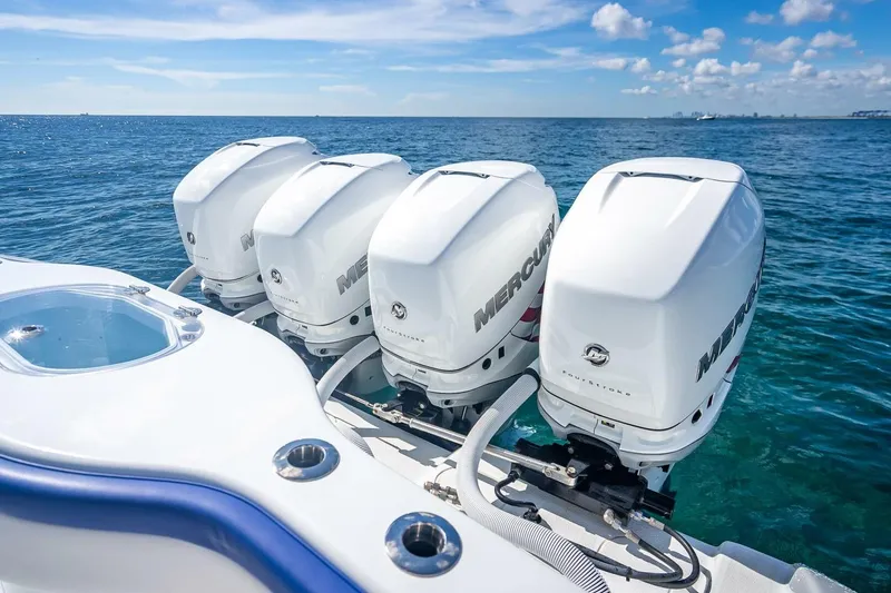 Slide: The Image of 2023 Yellowfin 39 Offshore boat with four Mercury outboard engines on open water. - 59