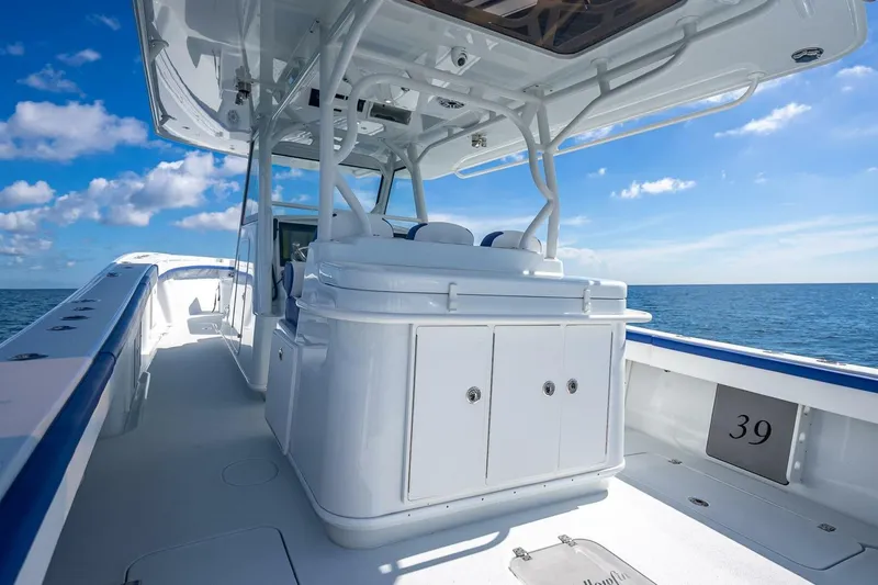 Slide: The Image of 2023 Yellowfin 39 Offshore boat interior with ocean view, clear skies, and modern design. - 60