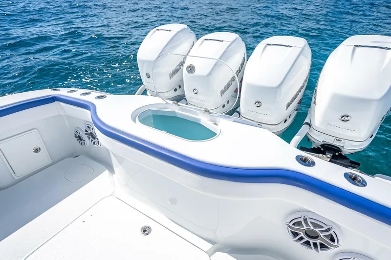 Slide: The Image of 2023 Yellowfin 39 Offshore boat with four powerful Mercury outboard engines on blue ocean. - 66