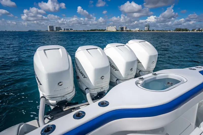 Slide: The Image of 2023 Yellowfin 39 Offshore boat with four Mercury outboard engines on open water. - 67