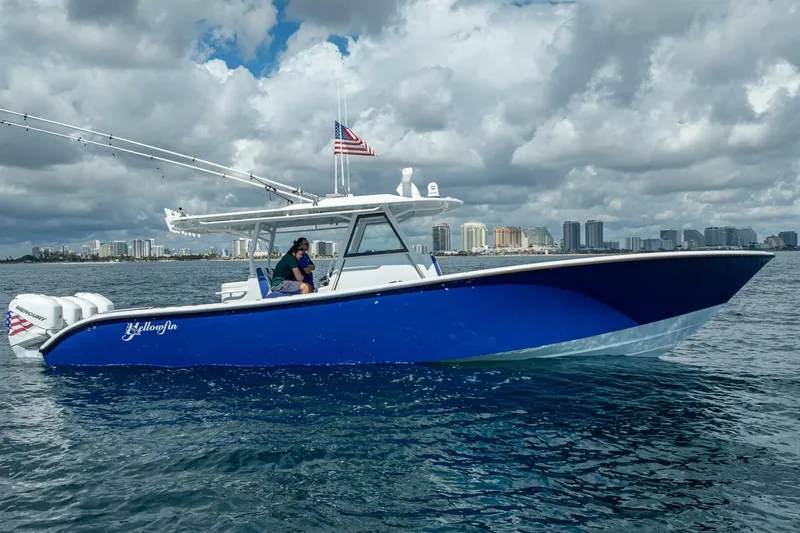Slide: The Image of 2023 Yellowfin 39 Offshore boat cruising on open water under cloudy skies. - 7