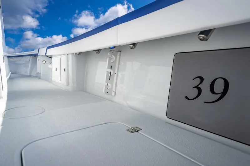 Slide: The Image of 2023 Yellowfin 39 Offshore boat deck with clear sky background. - 71