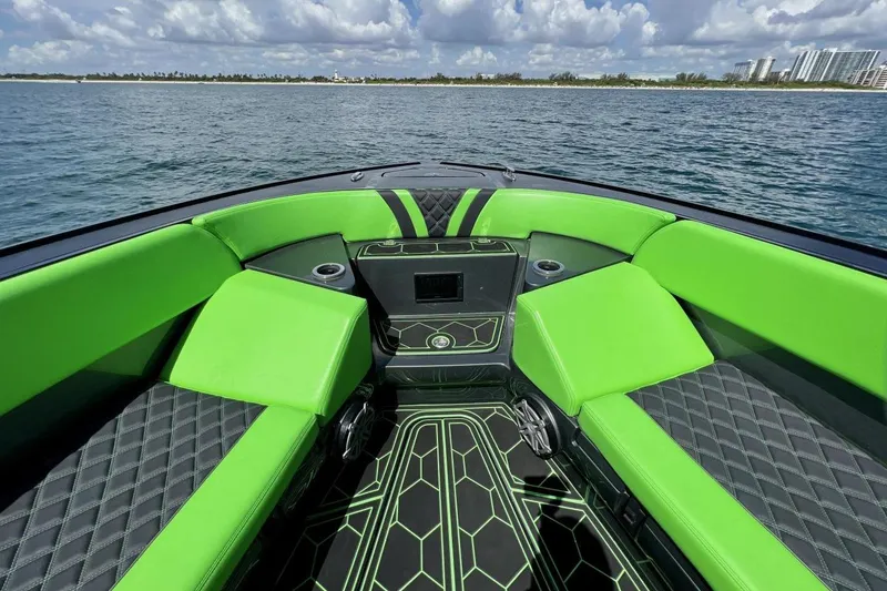 Slide: The Image of Luxury seating on 2020 Midnight Express 43 Open boat with vibrant green upholstery. - 10