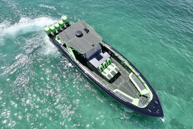 Slide: The Image of 2020 Midnight Express 43 Open boat cruising on clear turquoise water. - 18