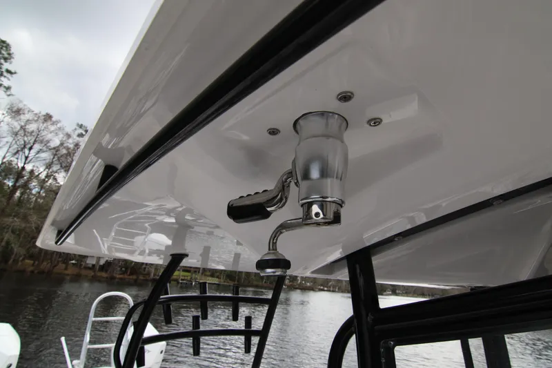 Slide: The Image of 2024 Twin Vee 280 GFX CC boat detail, featuring a mounted fishing rod holder. - 16