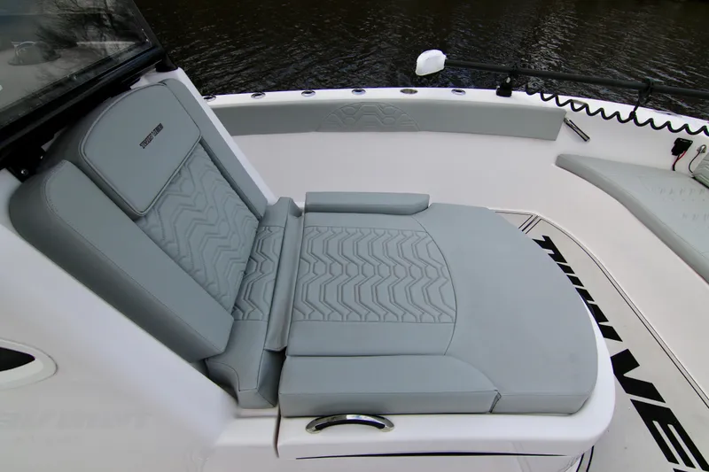 Slide: The Image of 2024 Twin Vee 280 GFX CC boat with luxurious gray seating and sleek design. - 22