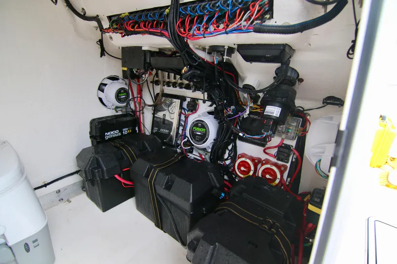 Slide: The Image of 2024 Twin Vee 280 GFX CC boat electrical system with wiring and battery setup. - 23