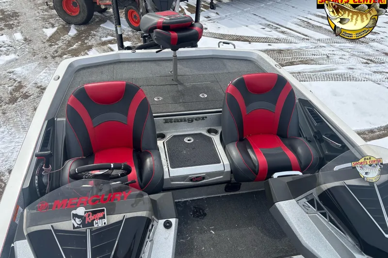 Slide: The Image of 2020 Ranger Z521L boat interior with red and black seats, snowy background. - 10