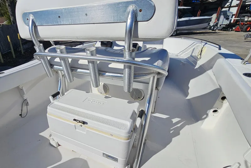Slide: The Image of 2014 Sea Fox 199 Commander boat interior with rod holders and cooler. - 13