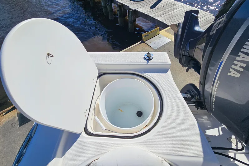 Slide: The Image of Open livewell on 2014 Sea Fox 199 Commander boat, dockside view. - 16