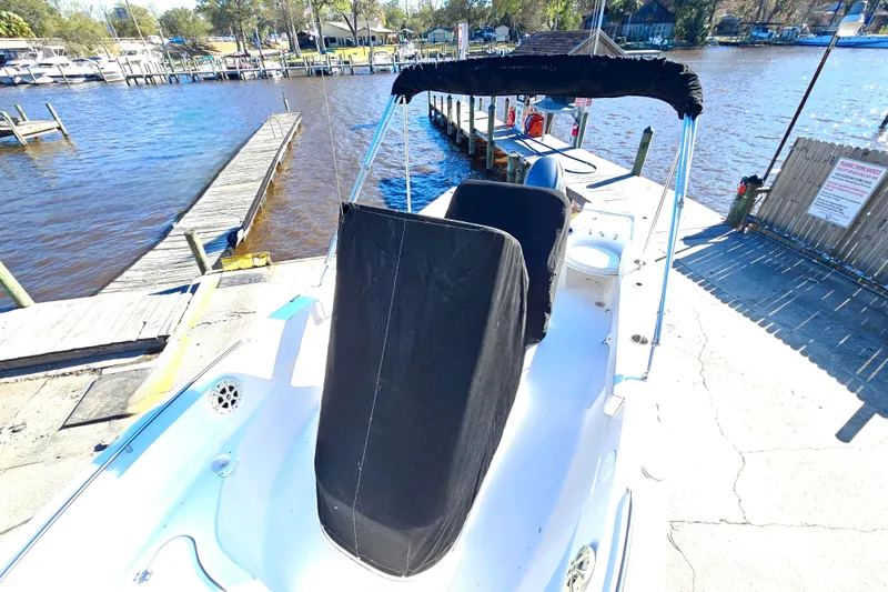 Slide: The Image of 2014 Sea Fox 199 Commander boat docked by a scenic waterfront. - 20