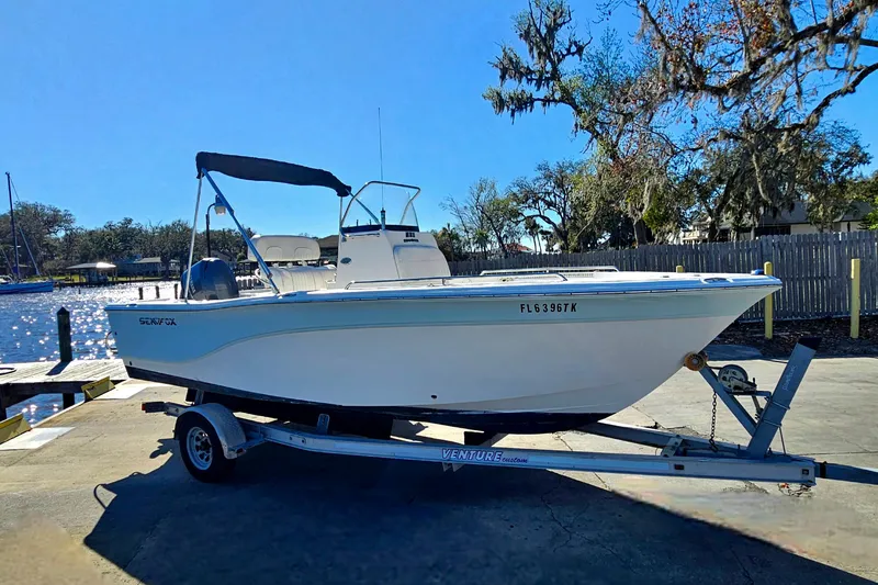 Slide: The Image of 2014 Sea Fox 199 Commander boat on trailer by waterfront dock. - 4