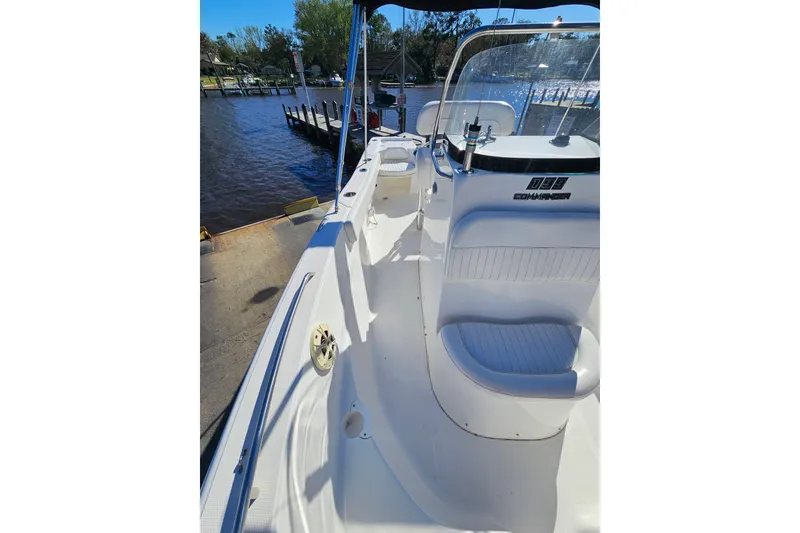 Slide: The Image of 2014 Sea Fox 199 Commander boat docked by a serene waterfront. - 9