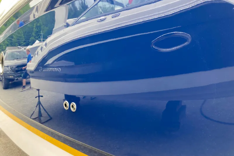 Slide: The Image of 2014 Regal 28 Express boat with sleek blue hull and chrome fittings. - 22