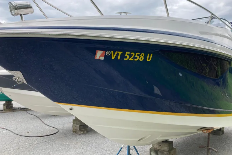 Slide: The Image of 2014 Regal 28 Express boat with registration VT 5258 U on display. - 24