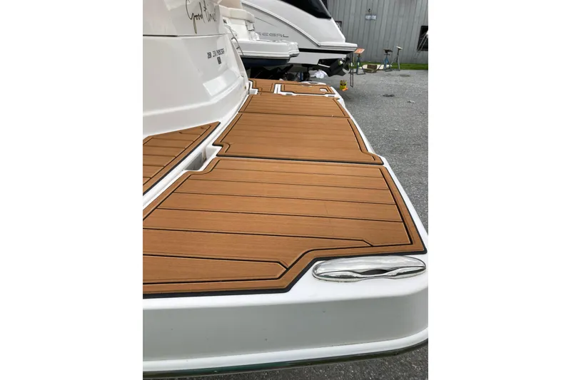 Slide: The Image of 2014 Regal 28 Express boat with teak-style swim platform. - 28