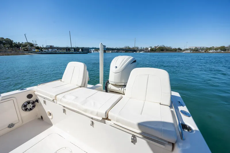 Slide: The Image of 2024 Grady-White 251 Coastal Explorer boat on calm water, featuring comfortable seating. - 12