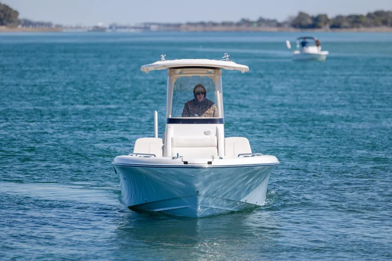 Slide: The Image of 2024 Grady-White 251 Coastal Explorer boat cruising on open water. - 3