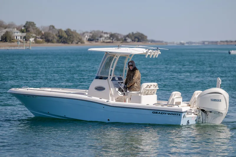 Slide: The Image of 2024 Grady-White 251 Coastal Explorer boat on calm blue water. - 7