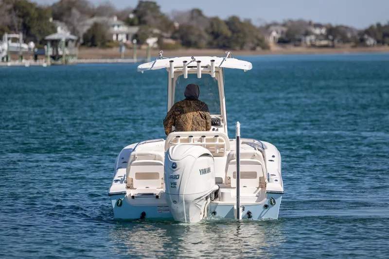 Slide: The Image of 2024 Grady-White 251 Coastal Explorer boat on water, rear view with Yamaha engine. - 8