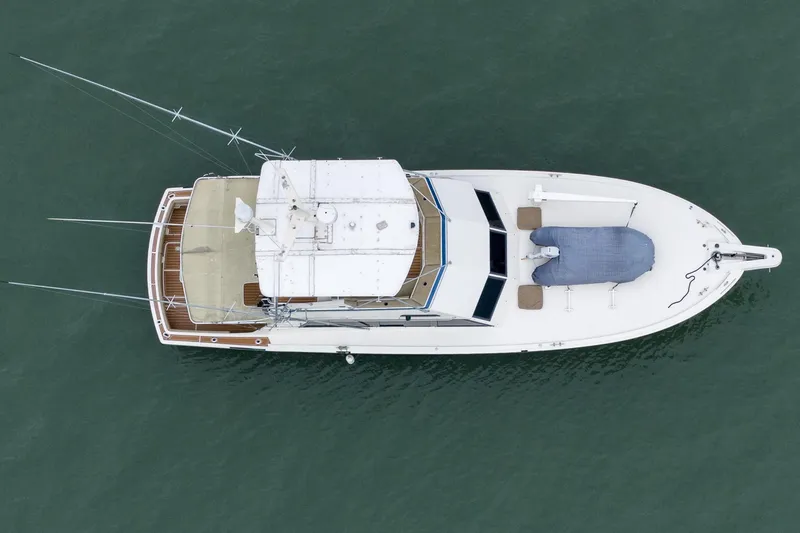 Slide: The Image of Aerial view of 1984 Hatteras 52 Convertible yacht on water. - 13