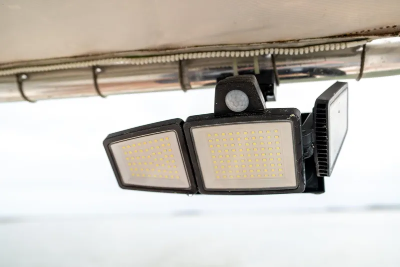 Slide: The Image of LED lights on a 1984 Hatteras 52 Convertible boat, mounted under a canopy. - 36