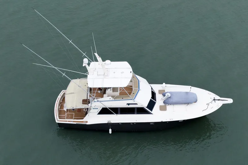 Slide: The Image of Aerial view of 1984 Hatteras 52 Convertible yacht on calm water. - 4
