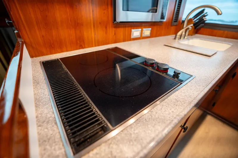 Slide: The Image of Modern kitchen in 1984 Hatteras 52 Convertible yacht with stovetop and sink. - 69