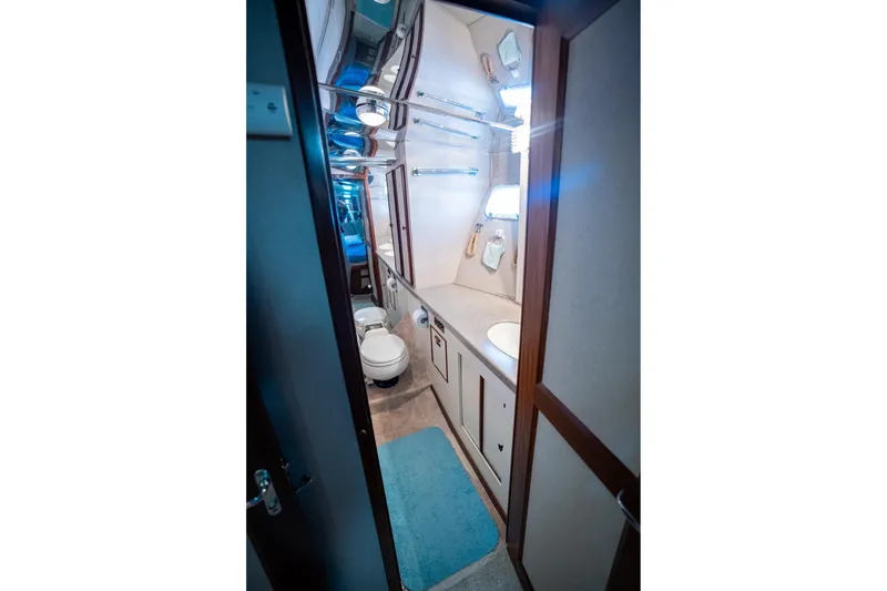 Slide: The Image of Bathroom interior of 1984 Hatteras 52 Convertible yacht, featuring modern amenities and sleek design. - 79