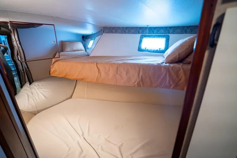 Slide: The Image of Interior cabin of 1984 Hatteras 52 Convertible yacht with bunk beds. - 85