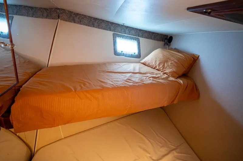 Slide: The Image of Cozy cabin interior of 1984 Hatteras 52 Convertible yacht with twin beds. - 88