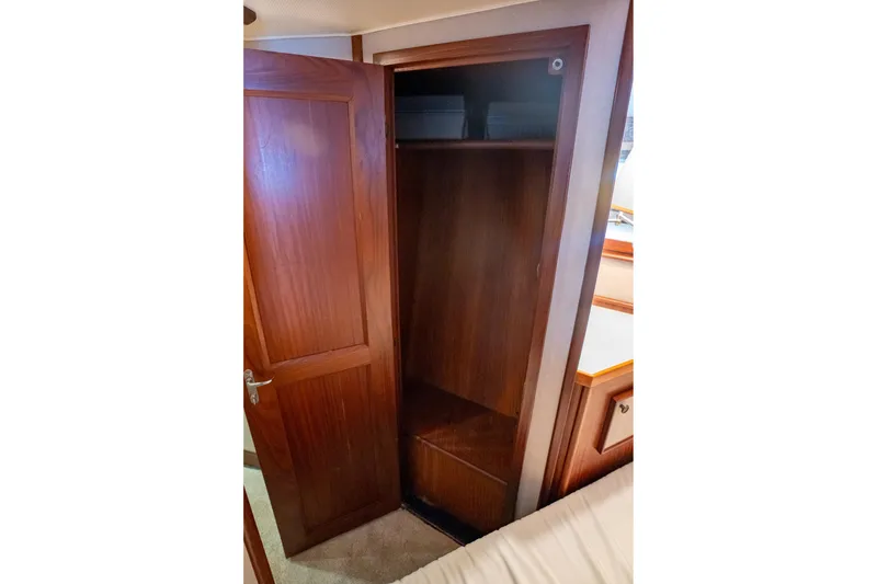 Slide: The Image of Wooden closet interior on 1984 Hatteras 52 Convertible yacht. - 89