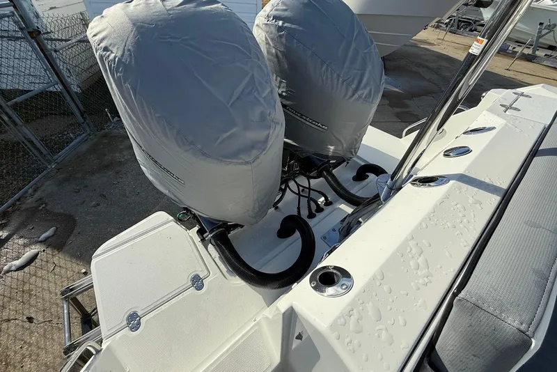 Slide: The Image of 2019 Blackfin 272 DC boat with covered dual outboard motors. - 13