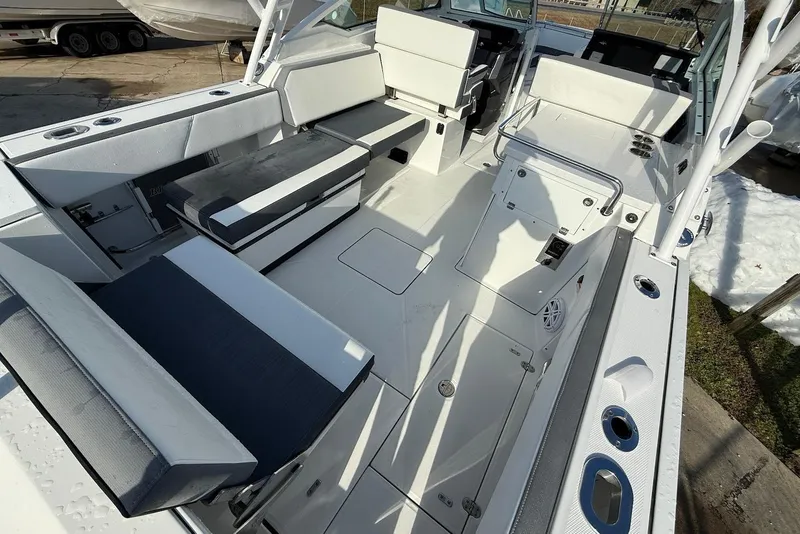 Slide: The Image of 2019 Blackfin 272 DC boat interior with white seating and modern design. - 15