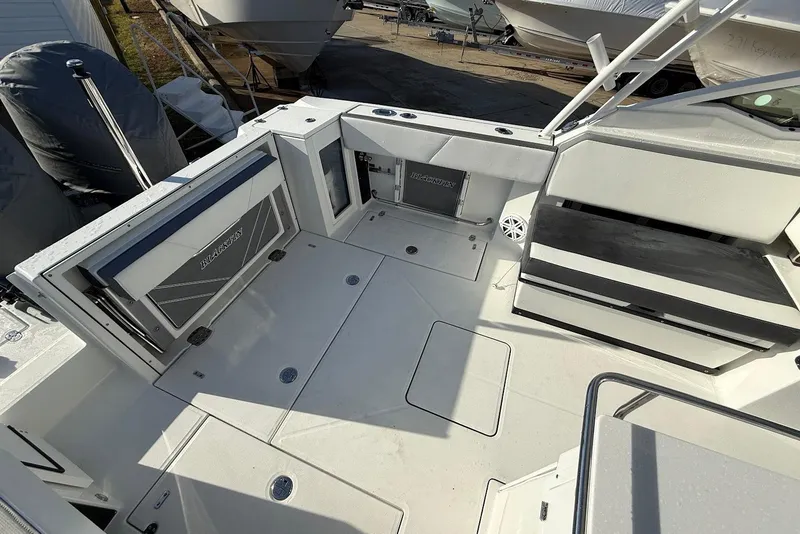 Slide: The Image of 2019 Blackfin 272 DC boat interior with seating and storage compartments. - 17