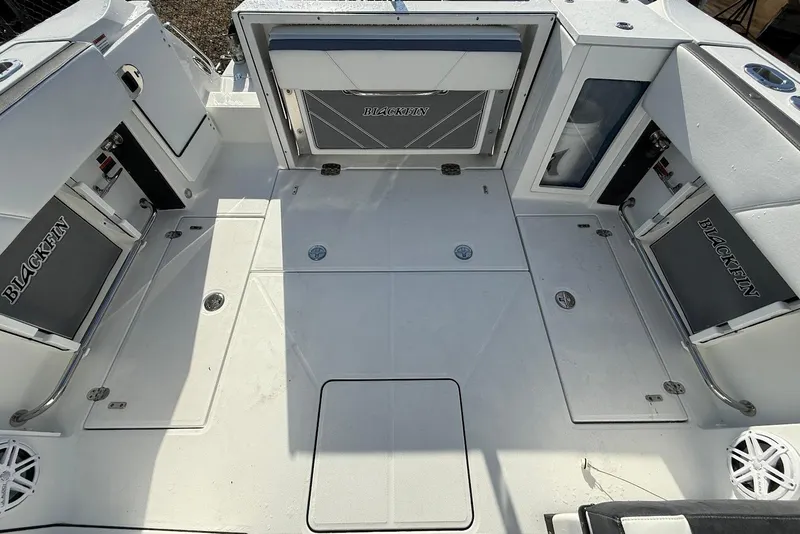Slide: The Image of 2019 Blackfin 272 DC boat deck with storage compartments and seating. - 18
