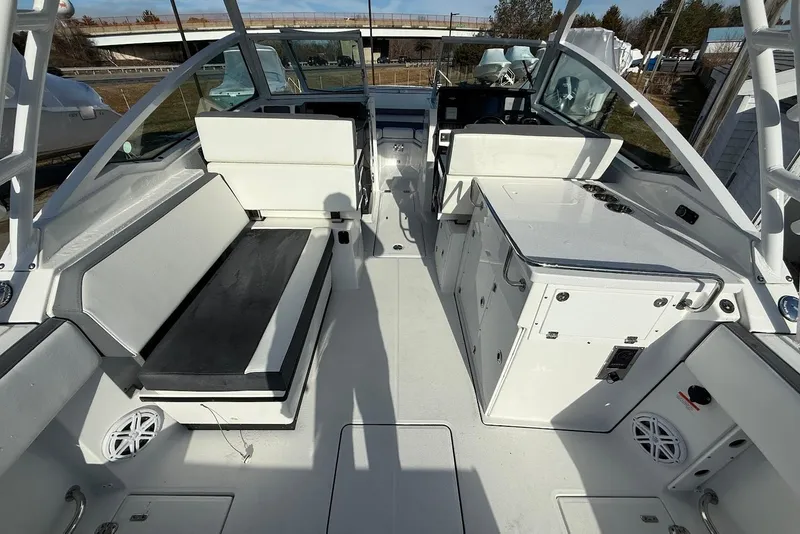 Slide: The Image of 2019 Blackfin 272 DC boat interior with seating and storage compartments. - 21