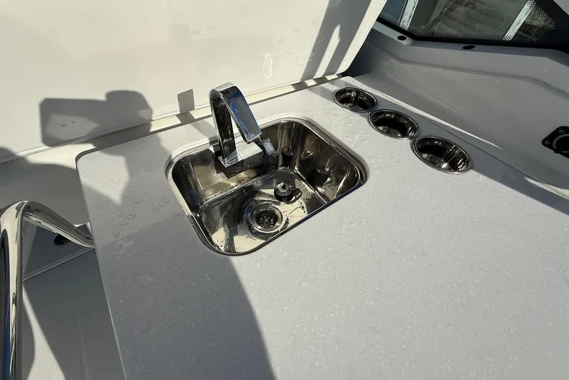 Slide: The Image of Stainless steel sink and cup holders on 2019 Blackfin 272 DC boat. - 23