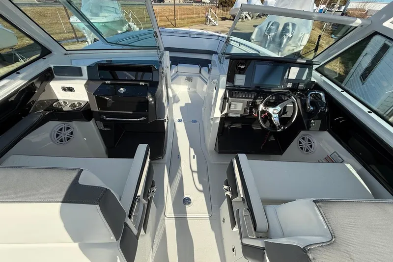 Slide: The Image of 2019 Blackfin 272 DC boat interior with modern dashboard and seating. - 26