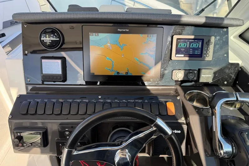 Slide: The Image of 2019 Blackfin 272 DC boat dashboard with navigation and control systems. - 31