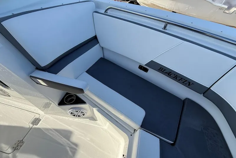 Slide: The Image of 2019 Blackfin 272 DC boat interior seating with sleek design and speaker system. - 36