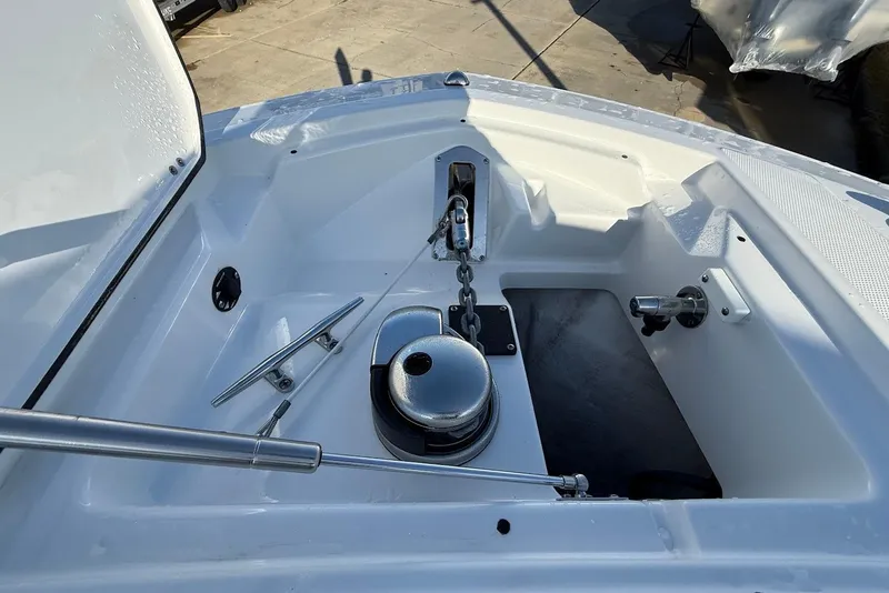 Slide: The Image of 2019 Blackfin 272 DC boat anchor compartment with chain and cleat. - 39
