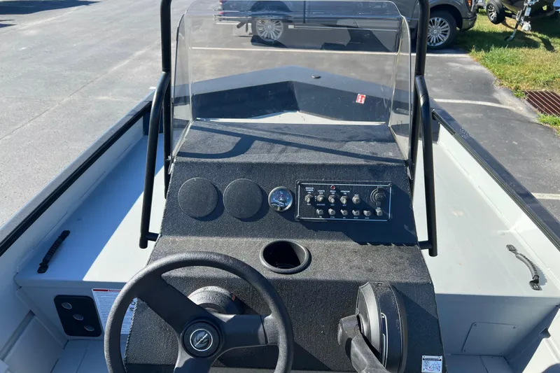 Slide: The Image of 2026 Crestliner 1870 Retriever FCC boat dashboard with steering wheel and control panel. - 11