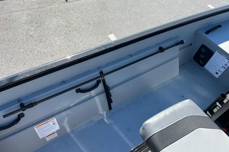 Slide: The Image of 2026 Crestliner 1870 Retriever FCC interior with rod holders and seating. - 13